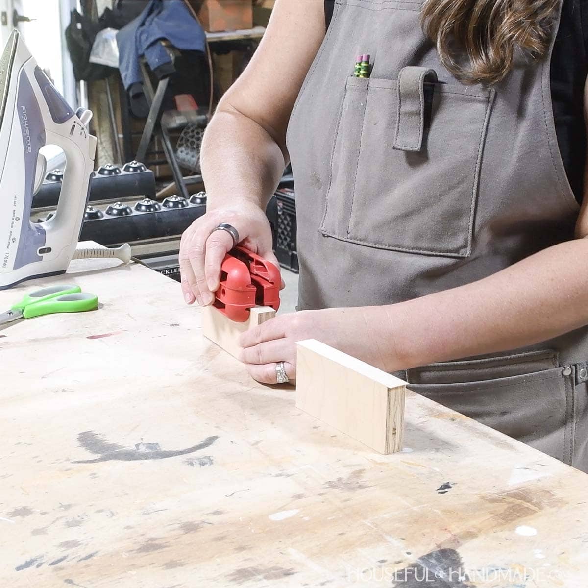 Adding edge banding to the top of the side pieces.