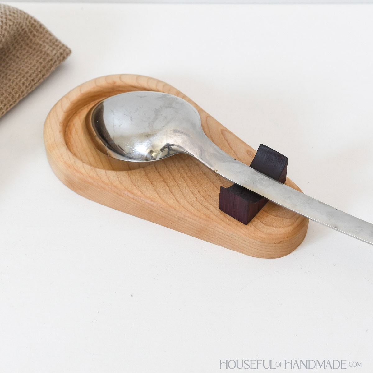 Solid wood spoon rest for next to stove.