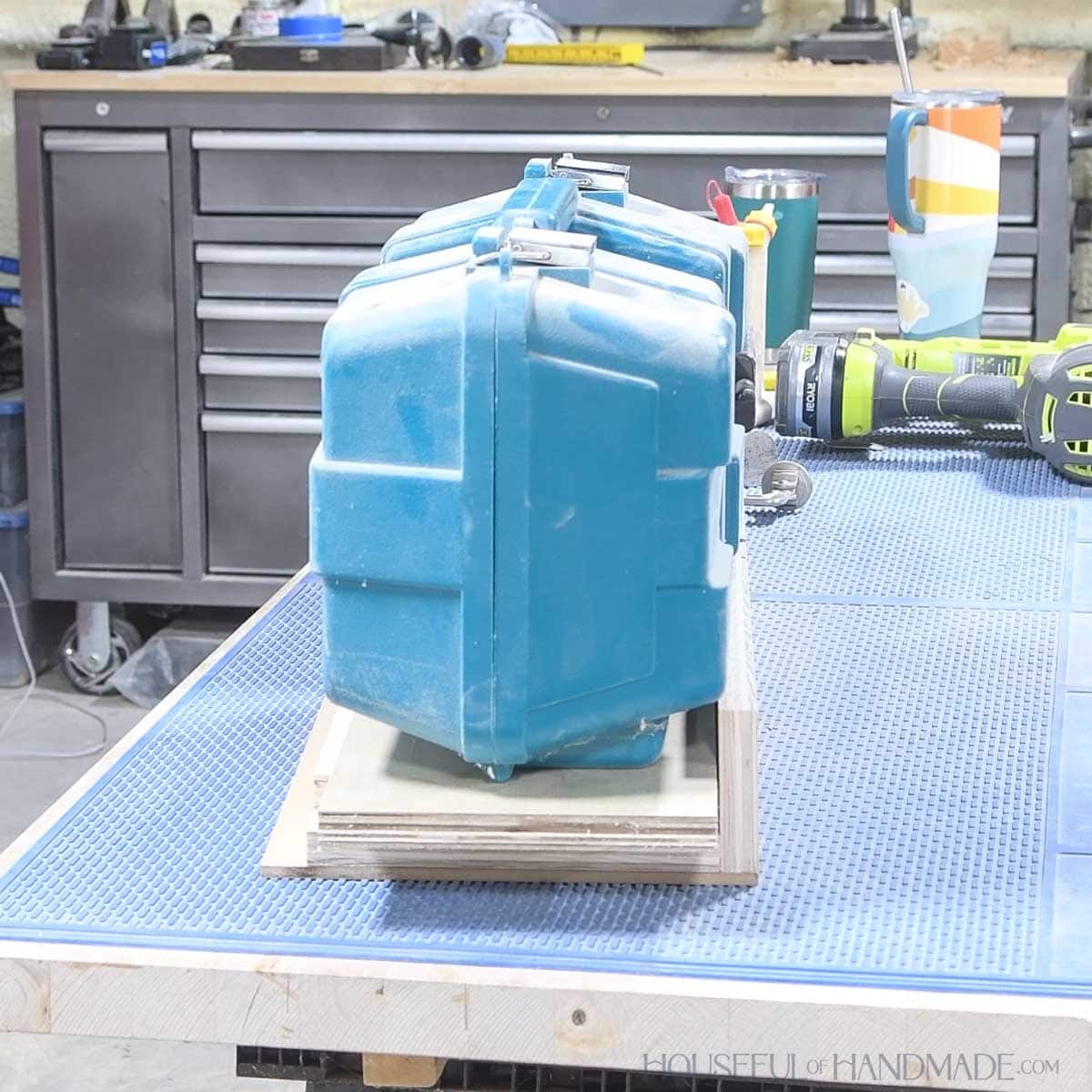 Using heavy items on top as a clamp.