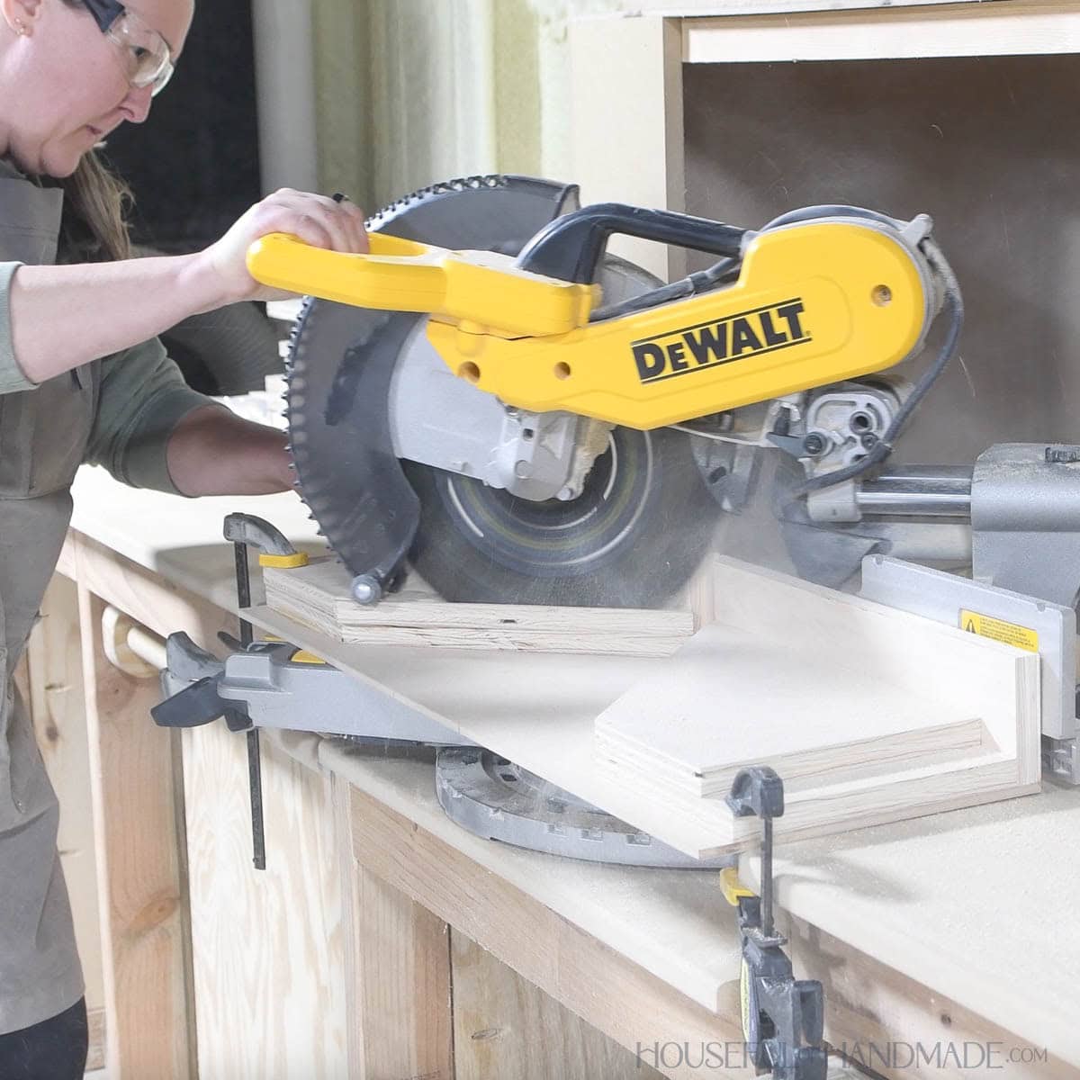 Trimming the fence on the jig to 45 degree angles to the miter saw.
