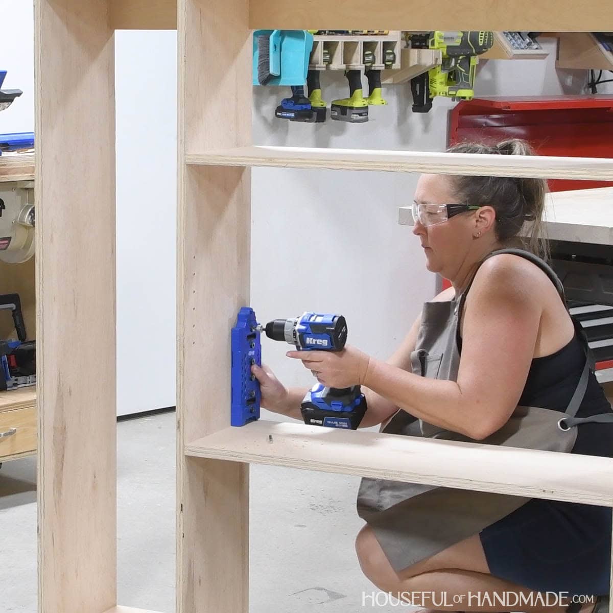Drilling a hole in the very top hole of the shelf pin jig.