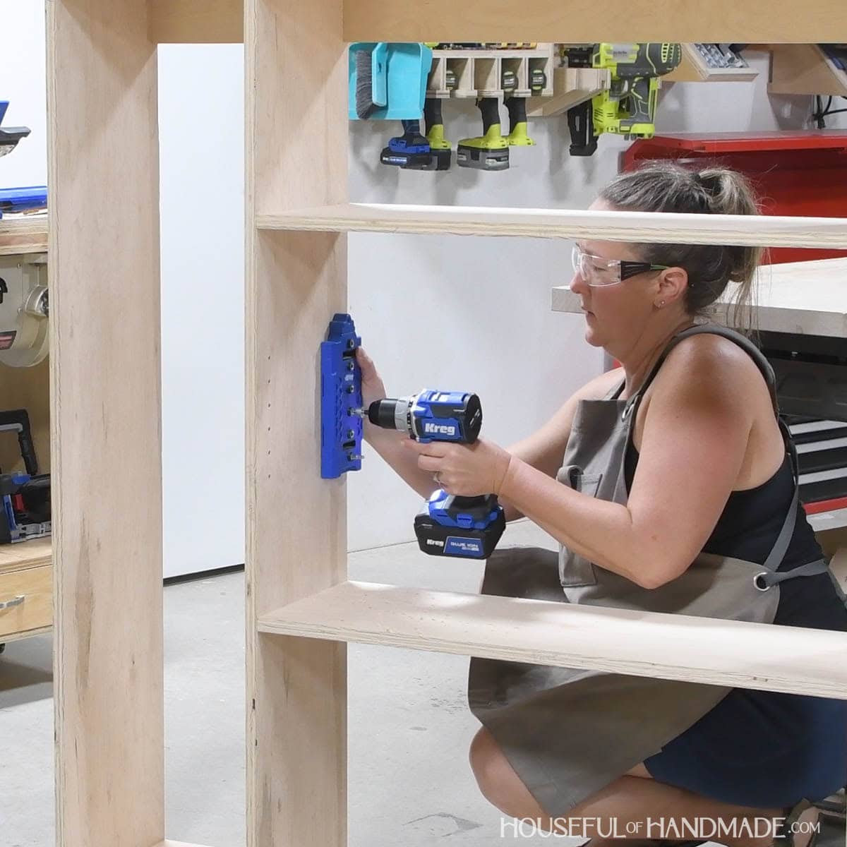 Drilling more holes in the upper part of the cabinet for shelf pins.