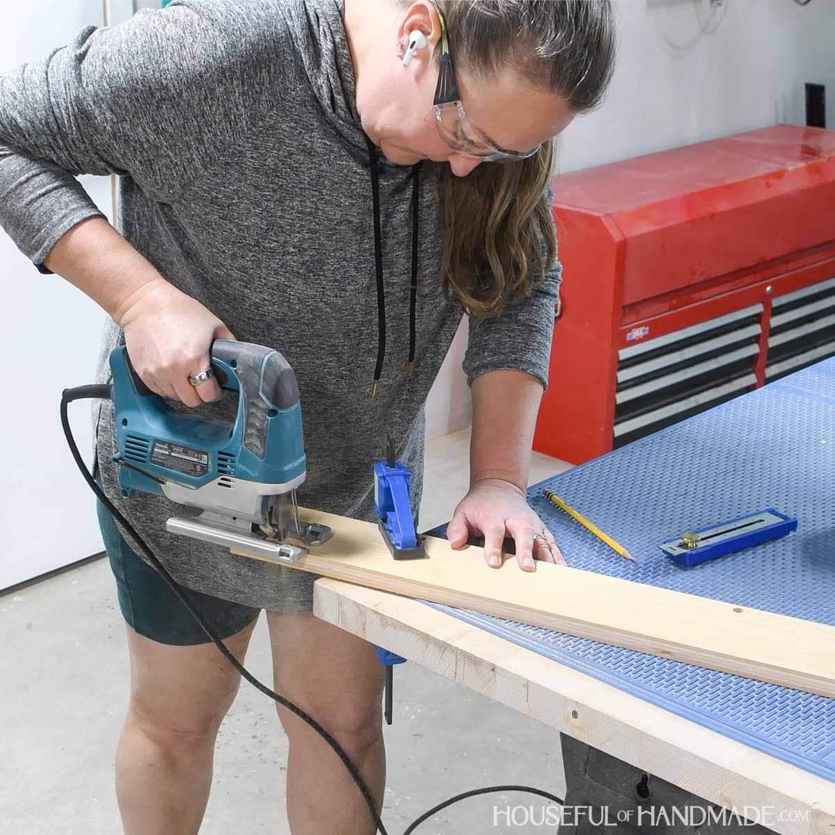 Cutting a notch for the baseboard with a jig saw. 