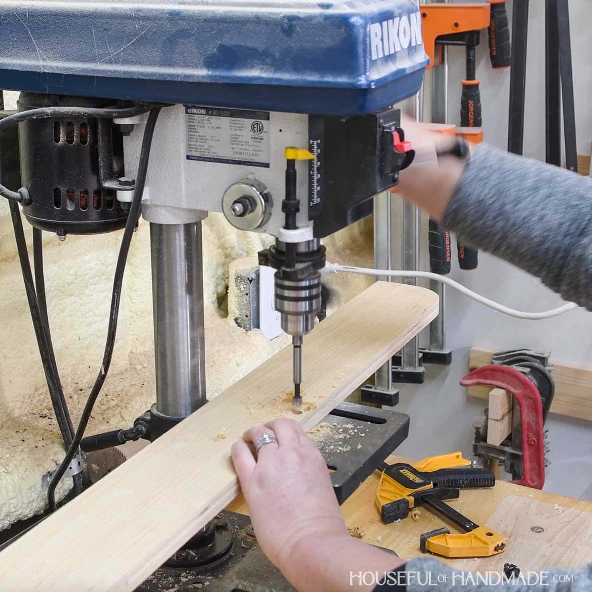 Drilling holes with a drill press. 