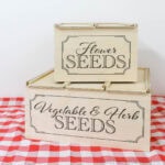 Two DIY wood seed storage boxes to hold seed packets.