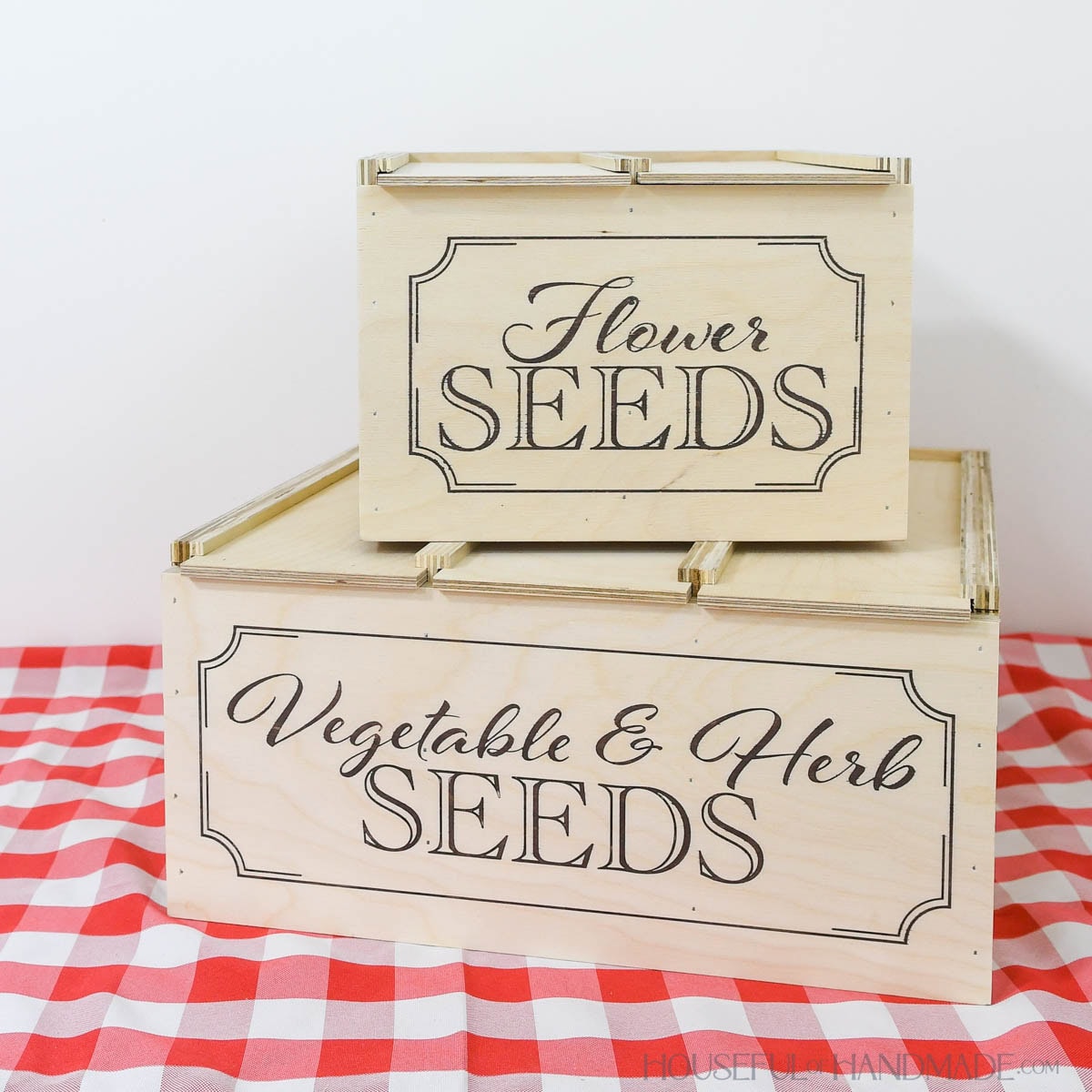 Two DIY wood seed storage boxes to hold seed packets.