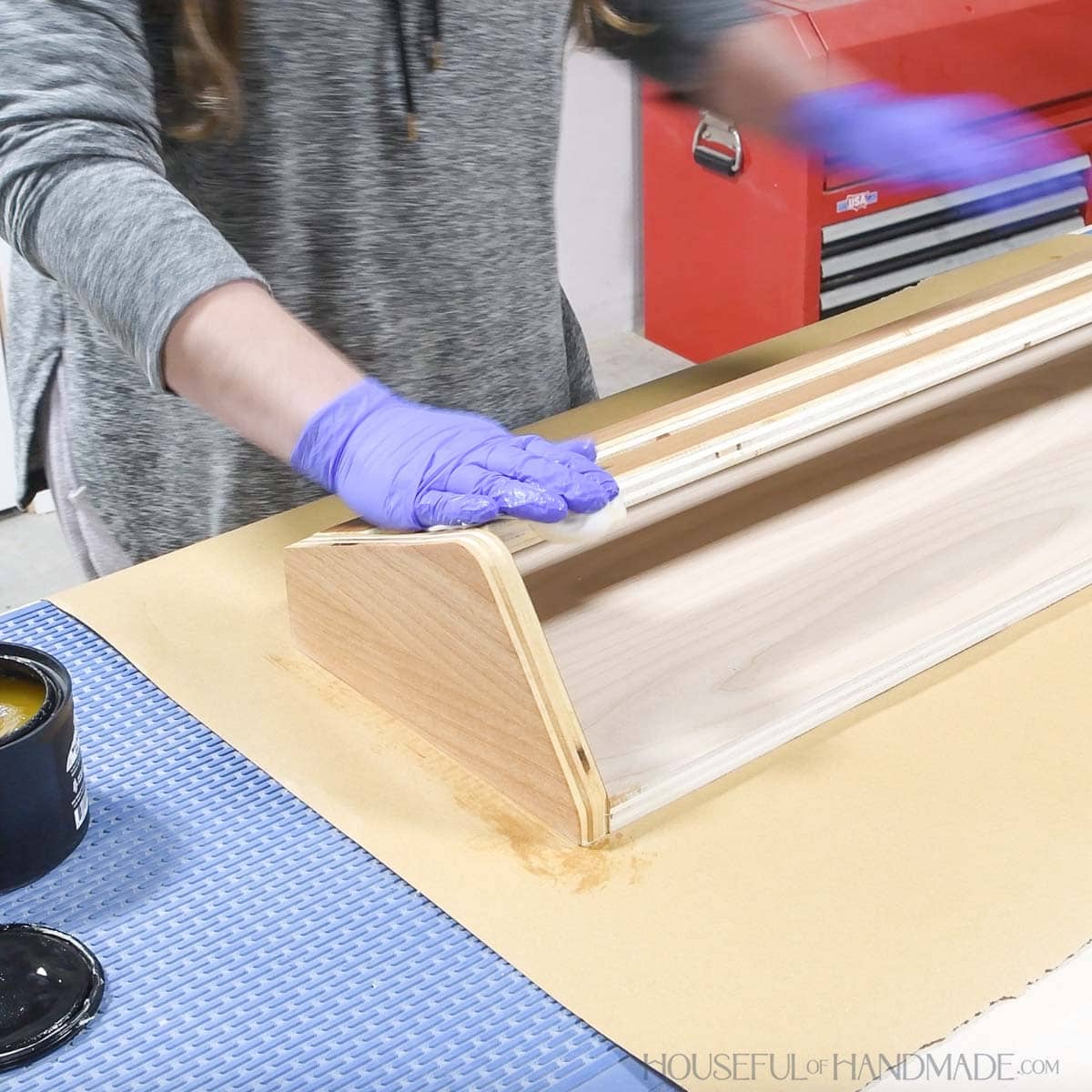 Sealing the finished shoe rack with Furniture Butter. 