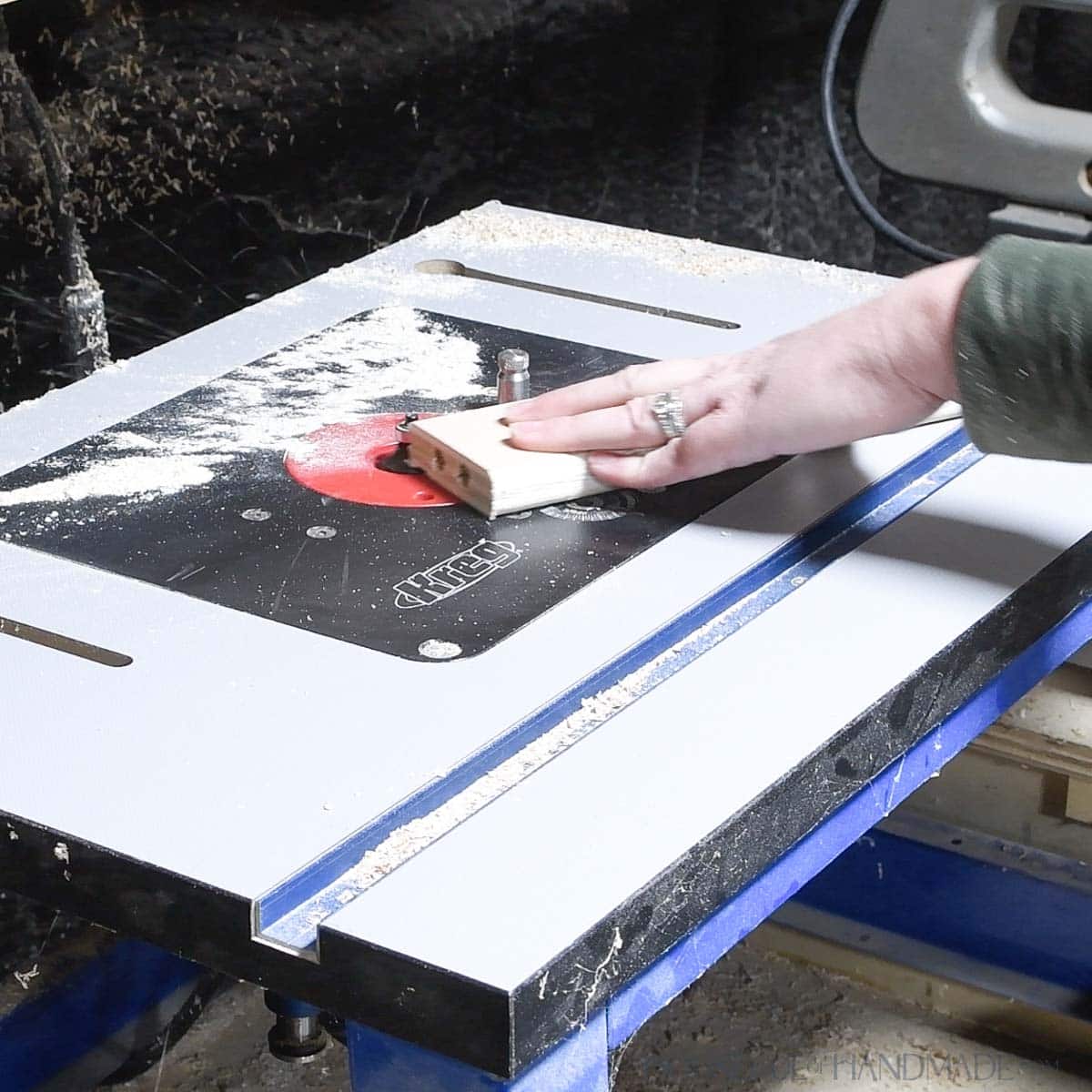 Using a router to add a roundover to the front rails. 