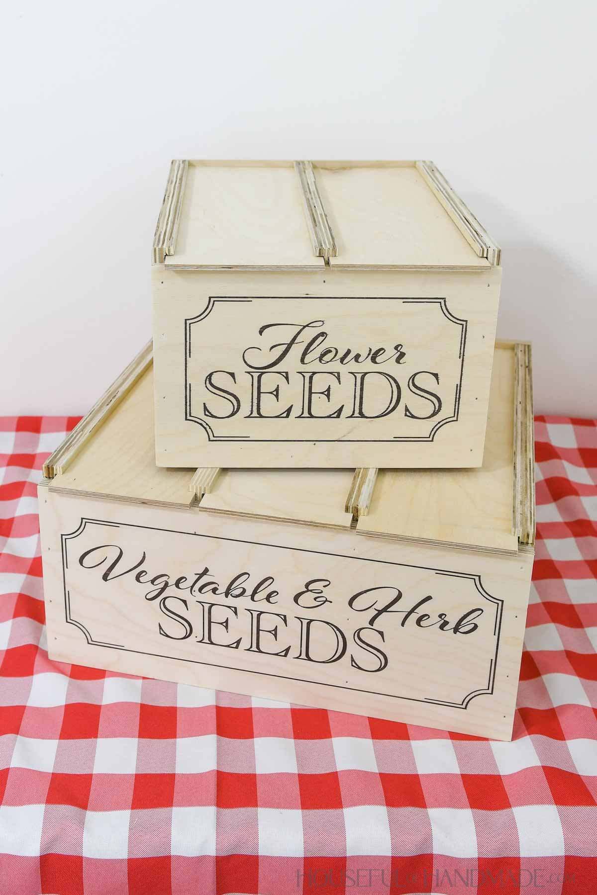 Two wood seed storage boxes, one for flower seeds and one for vegetable & herb seeds.