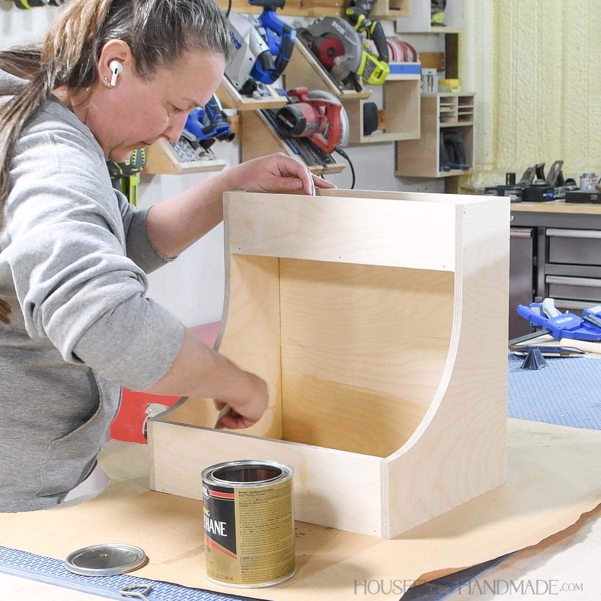 Sealing the under sink organizers with polyurethane. 