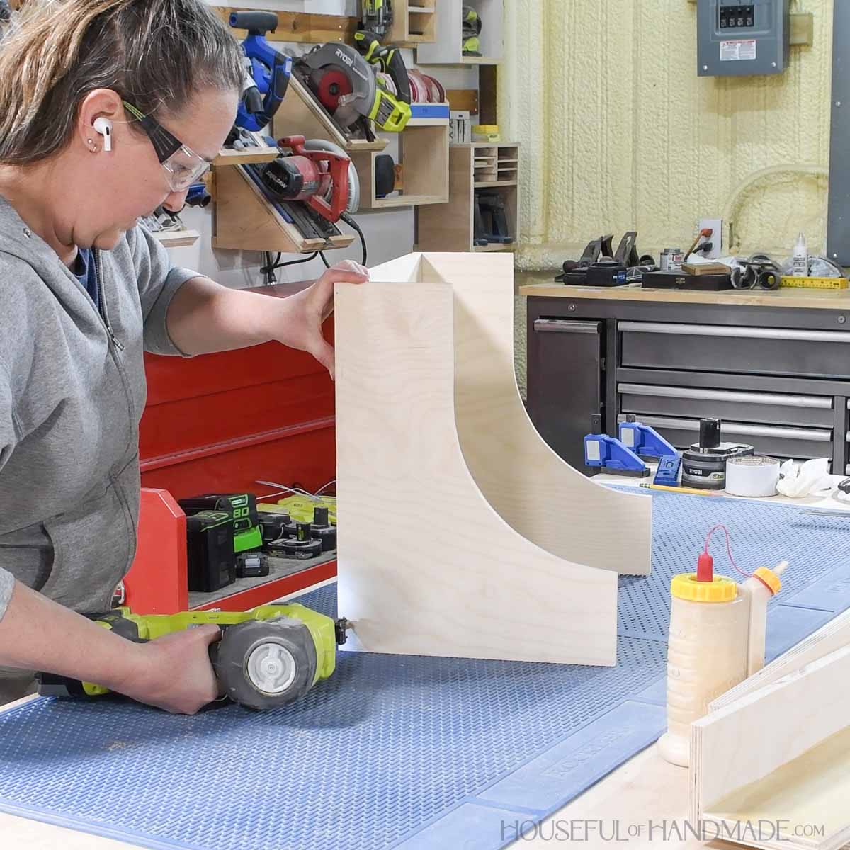 Attaching the sides to the back with a battery powered nailer. 