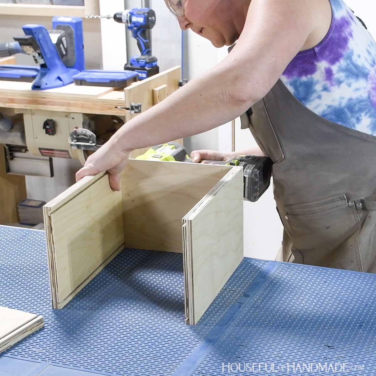 Attaching the back between the two sides.