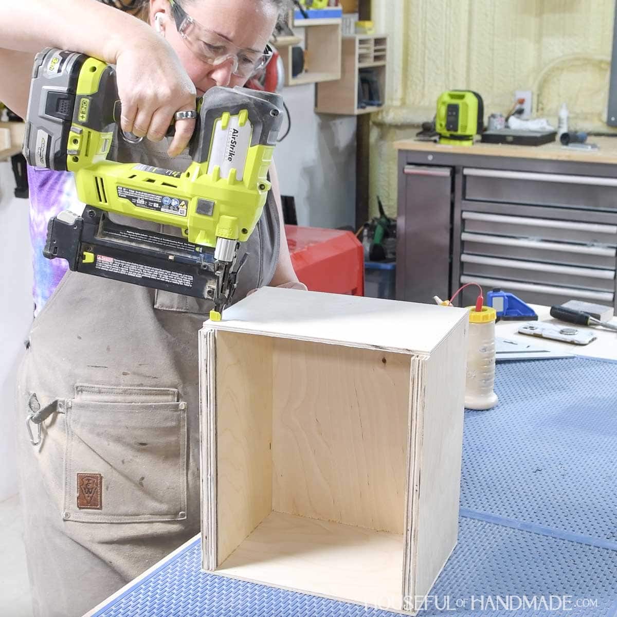 Attaching the front of the box with a brad nailer.