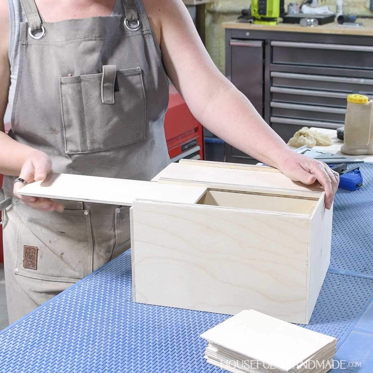 Sliding the top into the garden seed box.