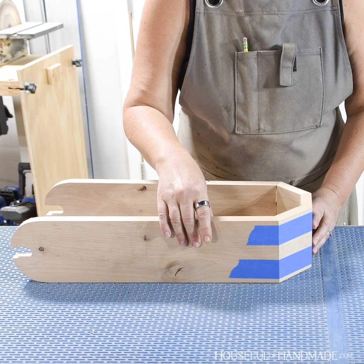 Glueing the toilet paper holder pieces together. 