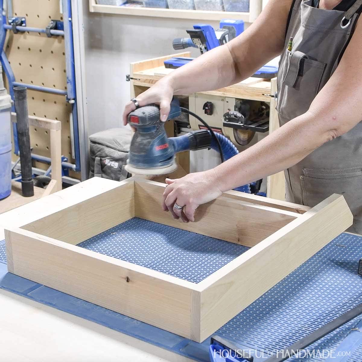 Sanding the finished frame.