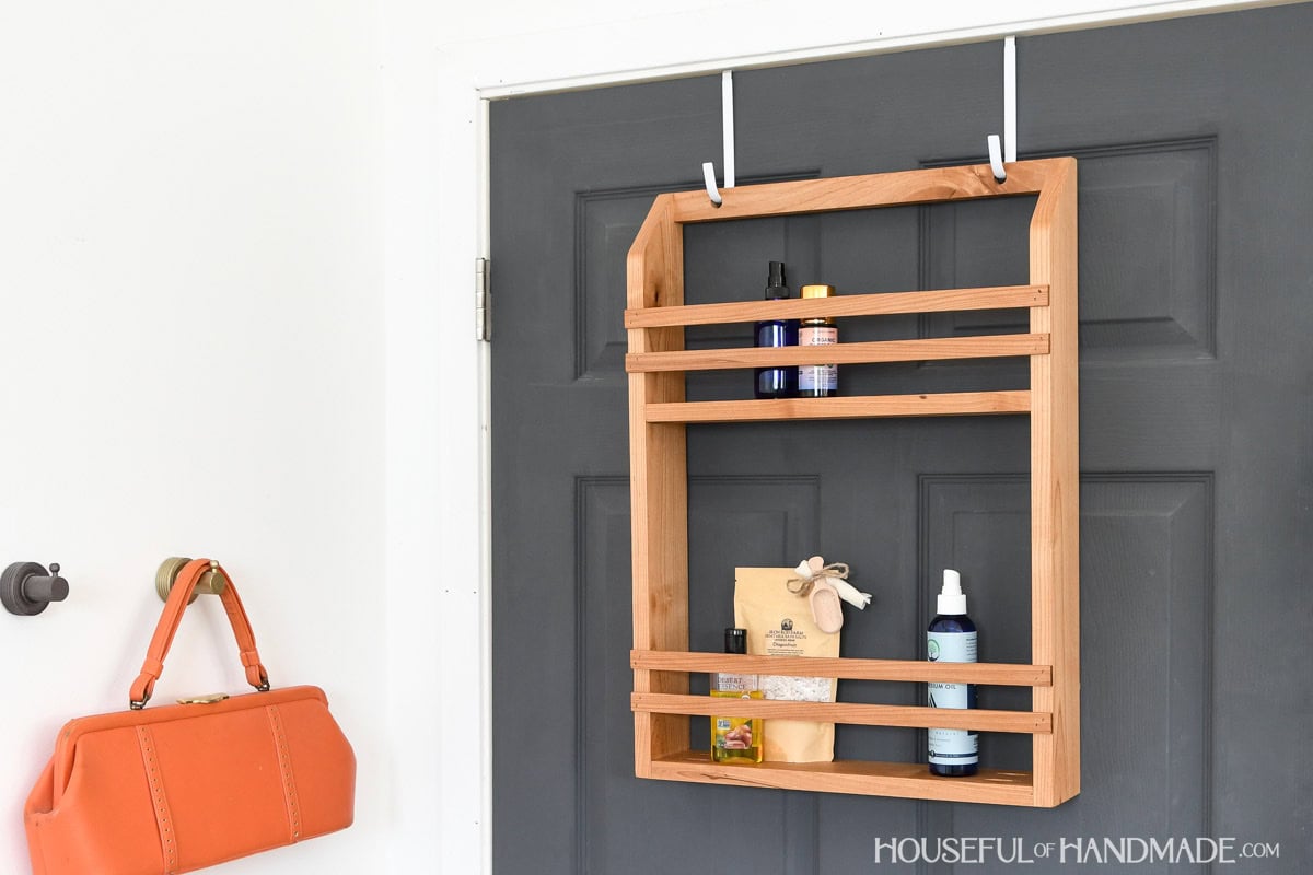 Over the door storage with 2 shelves made from wood. 
