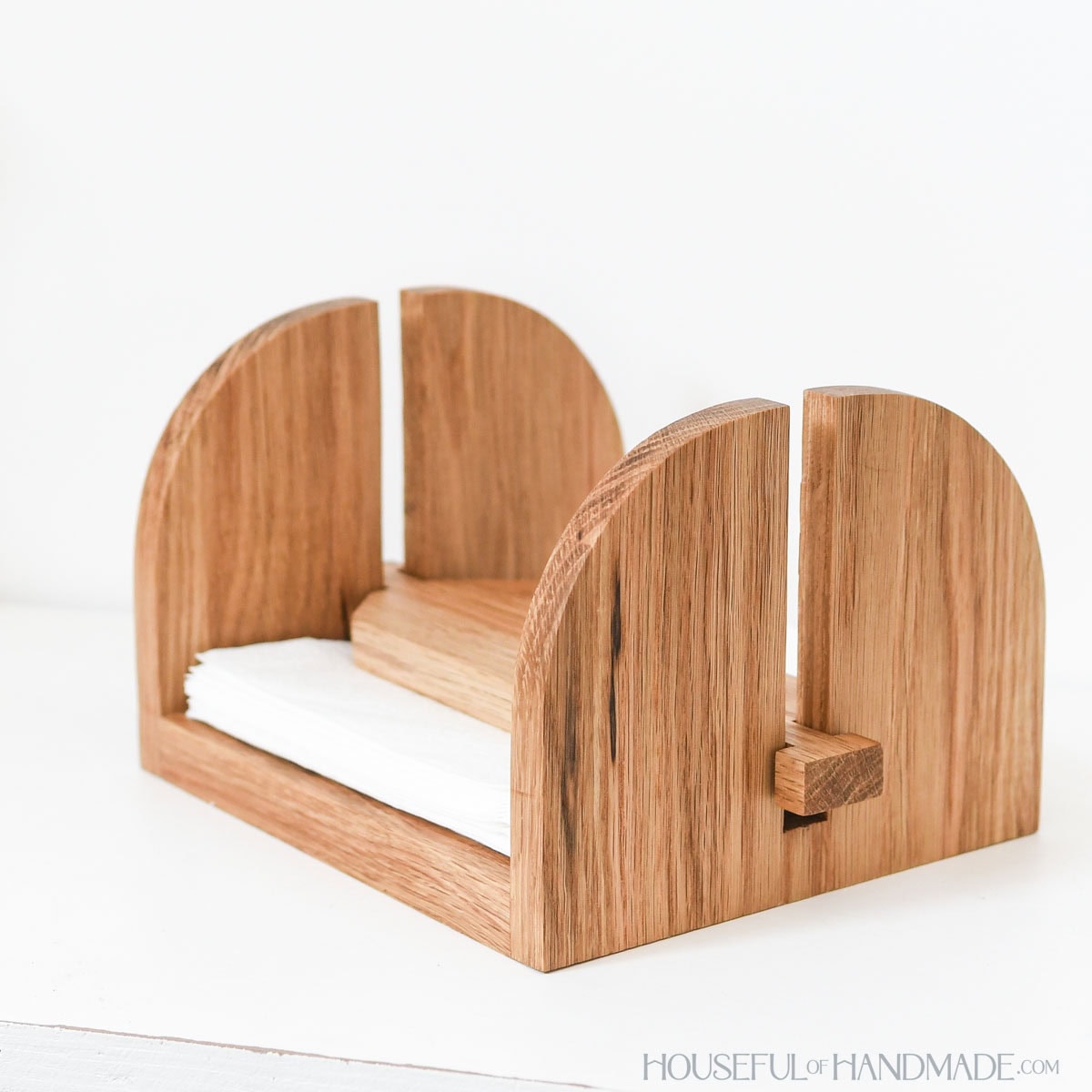 Wood napkin holder made from white oak with weight. 