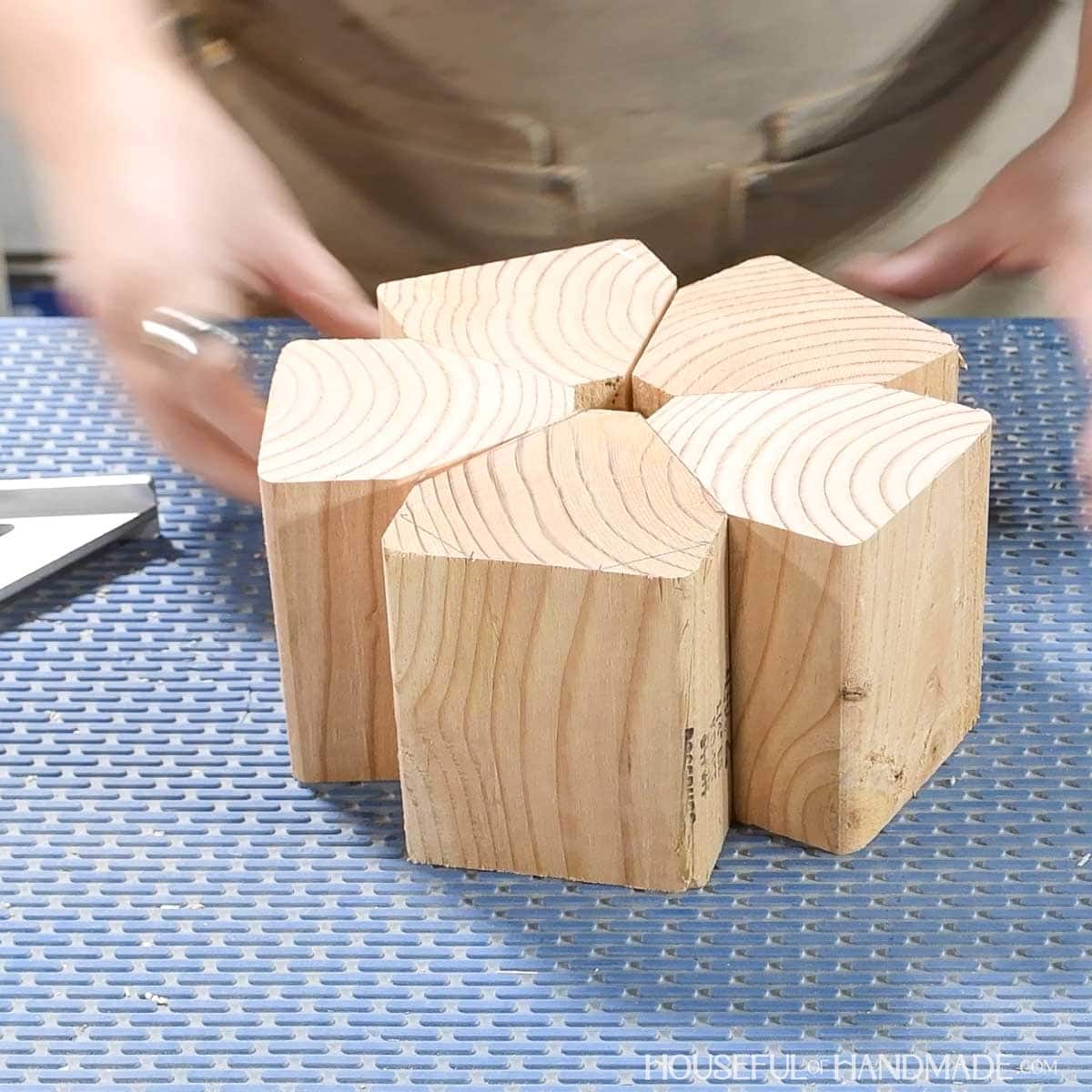 Five shaped blocks tucked together to create a circle.